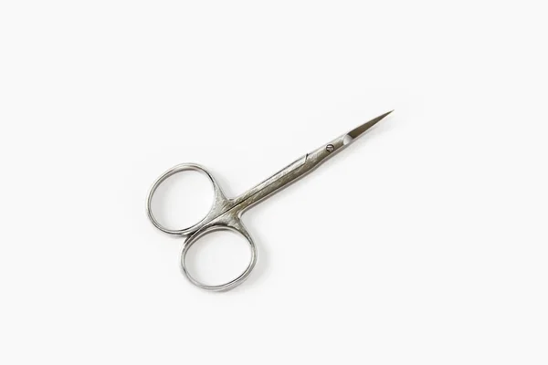 Metallic silver manicure sharp scissors on a white background — Stock Photo, Image