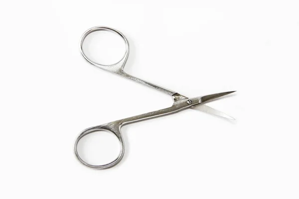 Metallic silver manicure sharp scissors on a white background — Stock Photo, Image