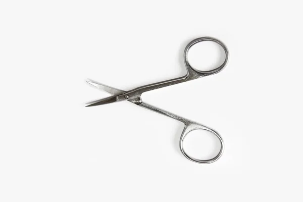 Metallic silver manicure sharp scissors on a white background — Stock Photo, Image