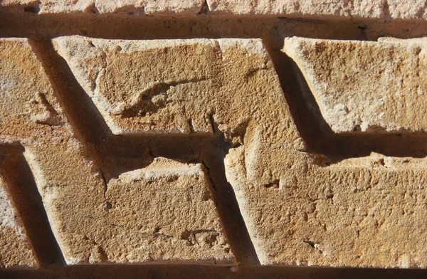 Pedra marrom ou mwith rachaduras e modeloparede sarble uma textura — Fotografia de Stock