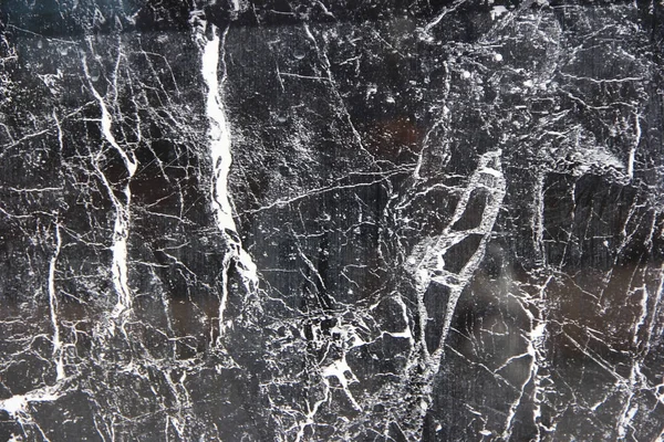 Texture of black a marble or tile with white stains and patterns Stock Image