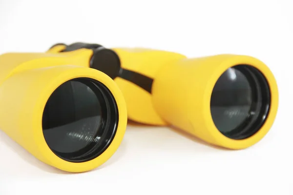 Yellow marine optical plastic binoculars on a white background — Stock Photo, Image
