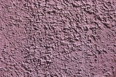 çatlak ve lekeleri ile eski bir duvarın pürüzlü pembe yüzey