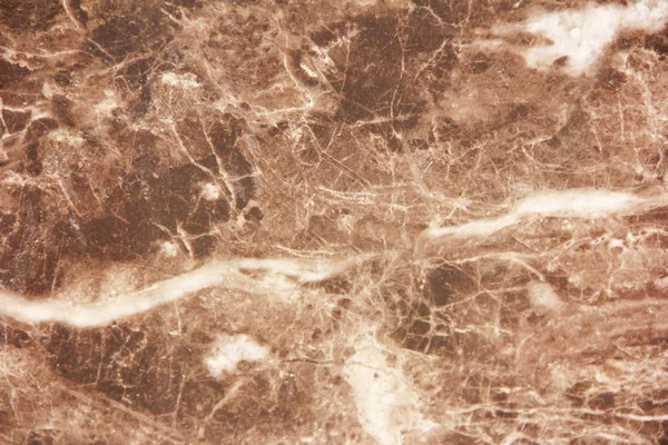 Marble brown decorative wall with patterns, stains and cracks Royalty Free Stock Images