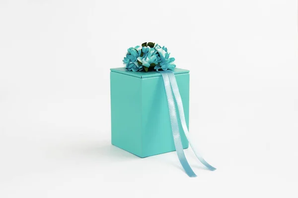 Decorative blue gift box with flower and ribbon designs — Stock Photo, Image