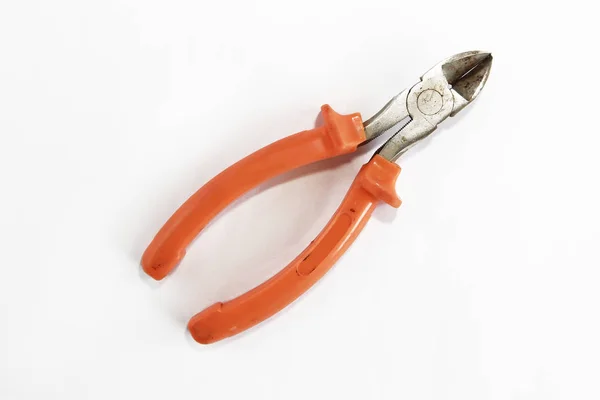 Old rusty pliers tools, metal cutting pliers with orange handle — Stock Photo, Image