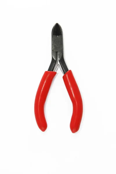 Old rusty pliers tools, metal cutting pliers with red handle — Stock Photo, Image