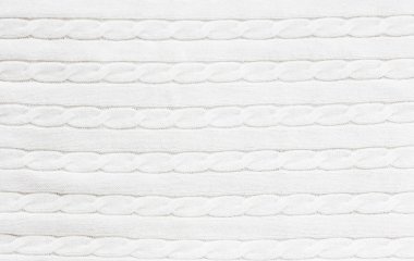 Örgü örülmüş beyaz kumaş dokusu ve at kuyruğu deseni.