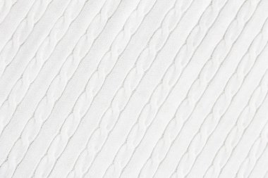 Örgü örülmüş beyaz kumaş dokusu ve at kuyruğu deseni.