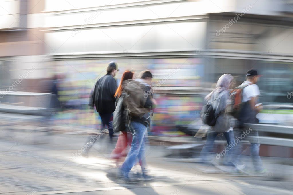 Unrecognizable people walking in the city, rush hour