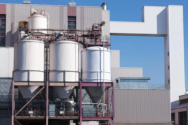 Stainless steel storage tank containers at the chemical plant fa Stock Image