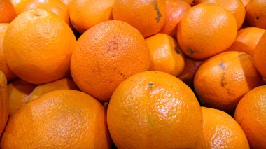 Olgun meyve portakal bir arka plan. Tatlı, lezzetli ve sağlıklı