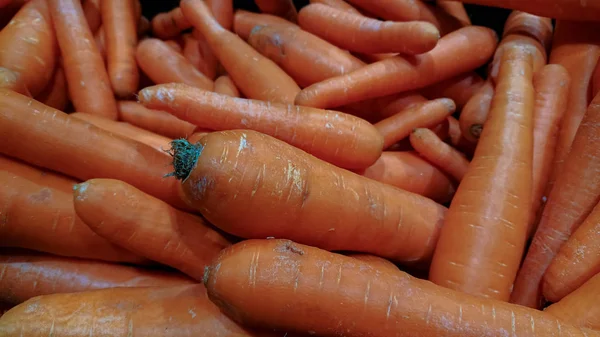 Sfondo di carota. Molte carote impressionante nel mercato — Foto Stock