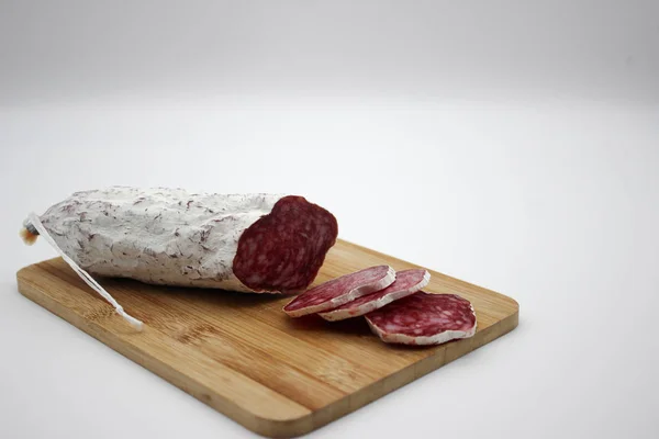 stock image Fuet Is A Catalan Thin, Dry Cured, Sausage Of Pork Meat In A Por