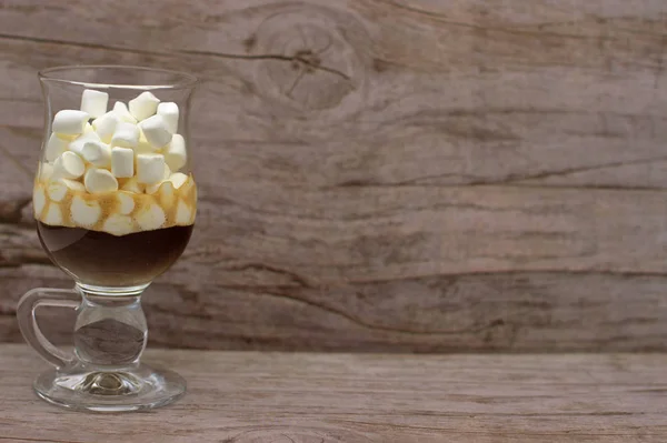 Coffee And Many Small Marshmallows In A Transparent Glass Cup On