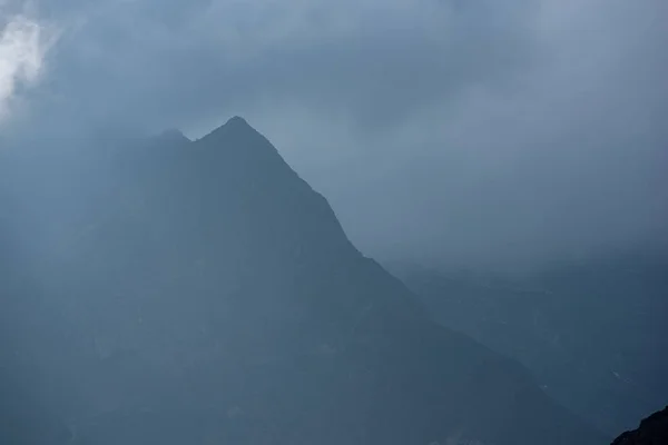 Silhouette outline of a mountain