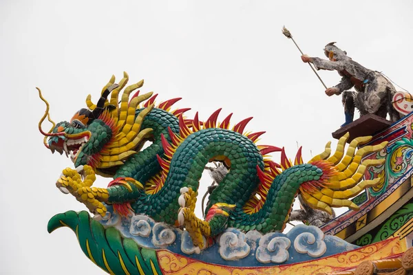 Golden dragon statue. Chinese dragon on the temple roof.