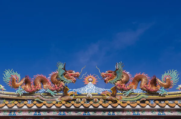 Golden dragon statue. Chinese dragon on the temple roof.