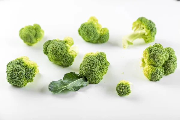 Raw smoll broccoli isolated on white background