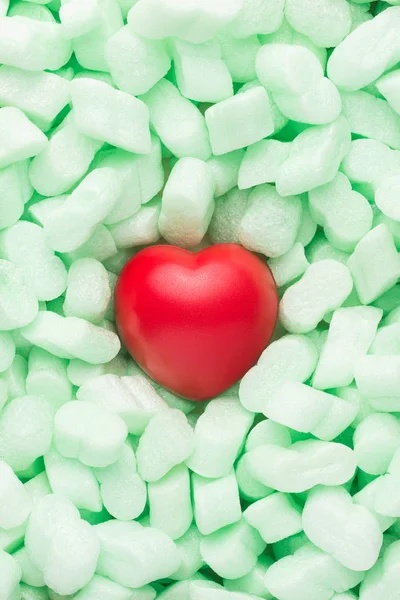 Red heart well protected by soft green material