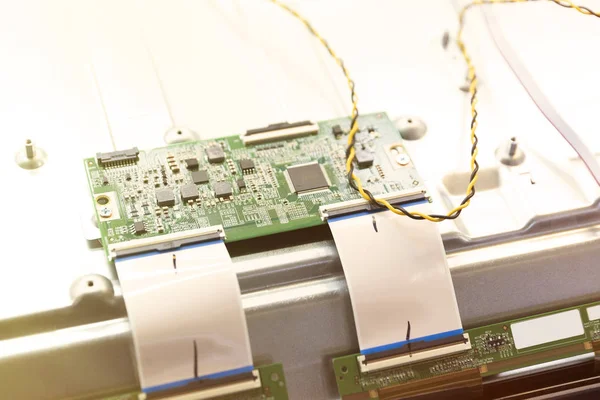 Assembling the TV in the factory in a clean room. Close-up of printed circuit Board