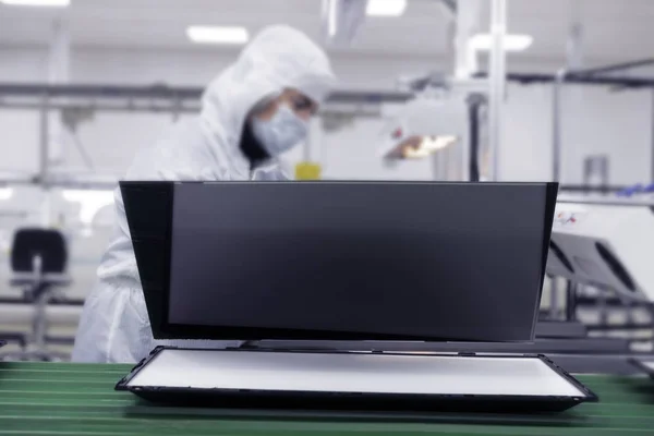 Assembling the TV in the factory in a clean room