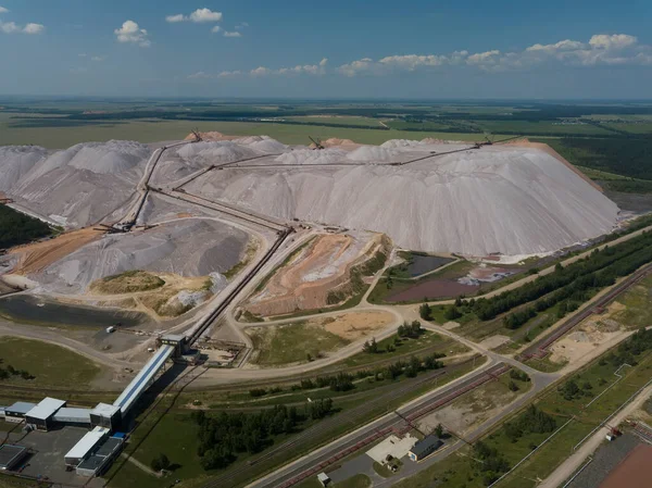 stock image Huge mountains of waste rock dumps during the extraction of potash. Potash fertilizer production plant