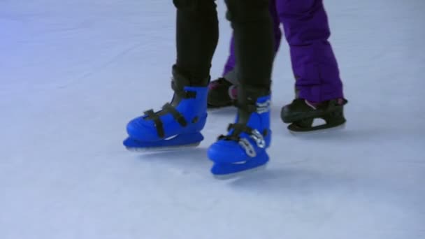 Closeup Kids Feet Wearing Skating Shoes While Learning Ice Skating — Stock Video