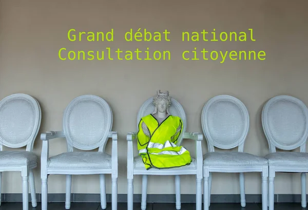 Marianne symbol of the French Republic with a yellow vest (gilet jaune)receiving the French for the Big debate national consultation citizen (written in French)