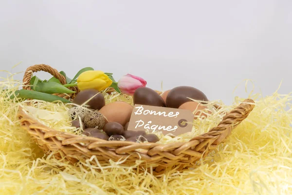 Joyeuses Pques Happy Easter Written French Label Wicker Basket Filled — Stock Photo, Image