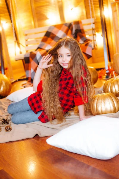 Little Cute Girl Long Curly Hair Swing Pumpkins Red Checkered — Stock Photo, Image