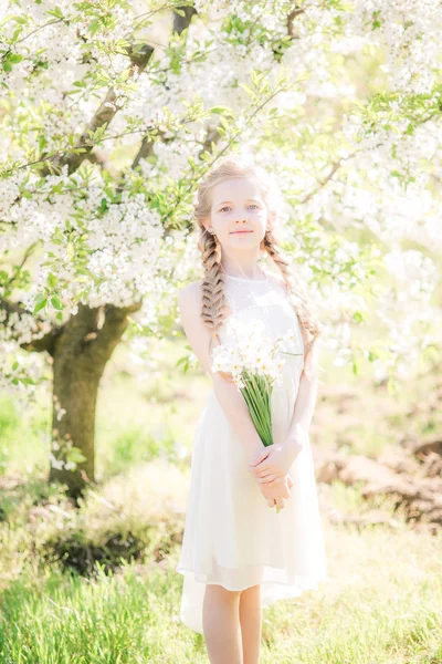 Cute Girl Blond Hair White Sundress Spring Lush Garden Daffodils — 图库照片