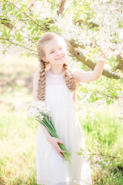 Cute Girl Blond Hair White Sundress Spring Lush Garden Daffodils — 图库照片