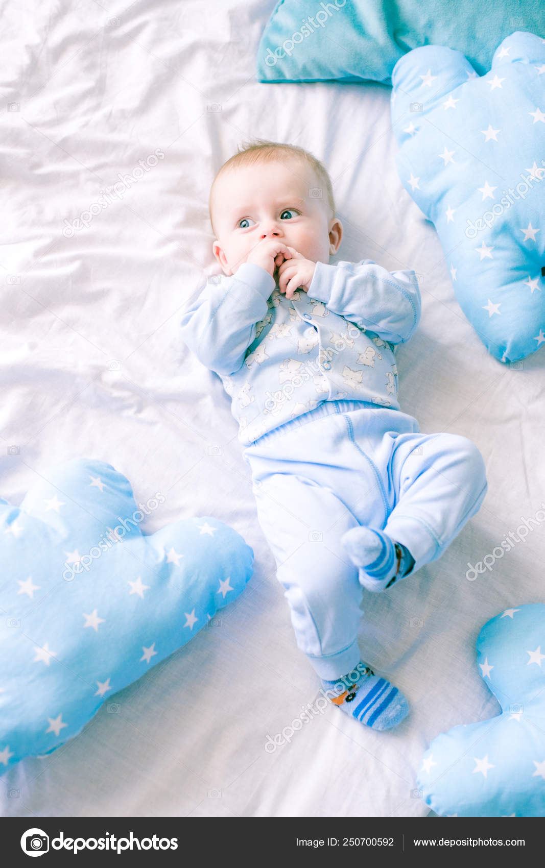 Cute Toddler Boy Bed Home Surrounded Blue Pillows Stock