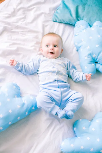 Cute Toddler Boy Bed Home Surrounded Blue Pillows — Stock Photo, Image