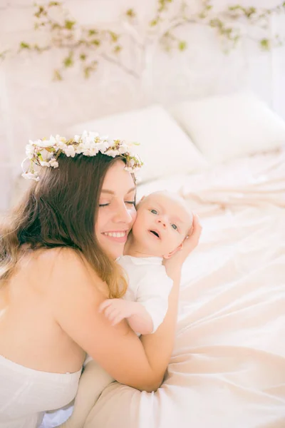 Young Cute Mom Wreath Cherry Blossoms White Dress Holding Baby — Stock Photo, Image