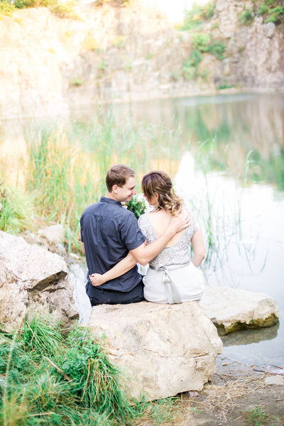 Elegant gentle stylish groom and bride near river or lake. Wedding couple in love 