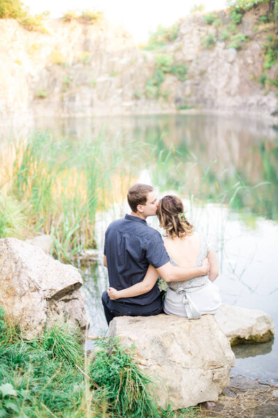 Elegant gentle stylish groom and bride near river or lake in summer. Wedding couple in love 