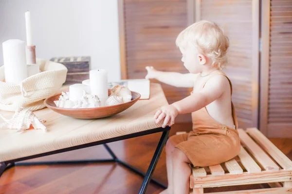 Little Cute Baby Blond Curly Hair Wooden Table Shells Candles — Stock Photo, Image