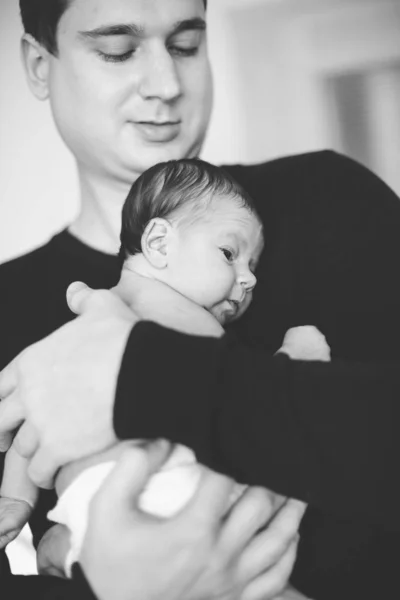 Close up father  holding newborn baby, copy space background banner family parents love sad concept