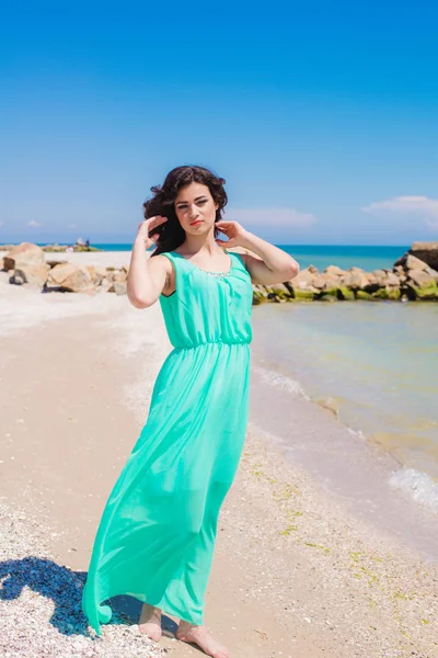 Young girl on summer beach with shell — Stock Photo, Image