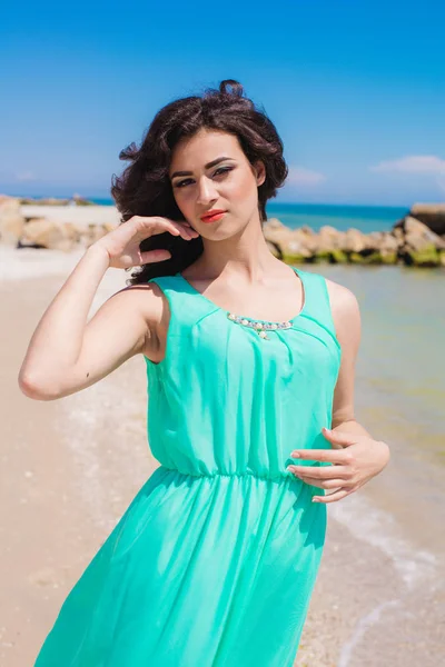 Young girl on summer beach with shell — Stock Photo, Image