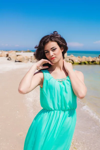 Young girl on summer beach with shell — Stock Photo, Image