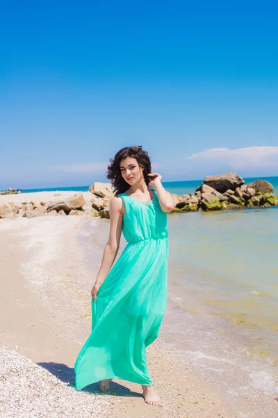 Young girl on summer beach with shell — Stock Photo, Image