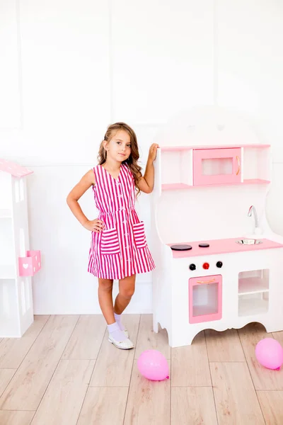Cute Happy Girl Beautiful Dress Home Plays Dollhouse Toys — Stock Photo, Image