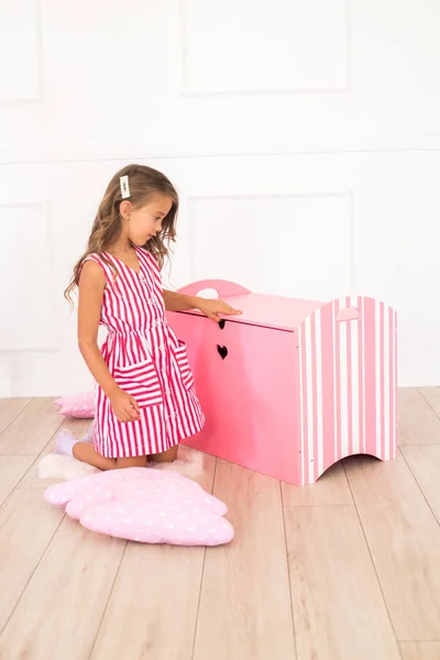 Cute Girl Beautiful Dress Home Plays Decorative Chest Toys — Stock Photo, Image