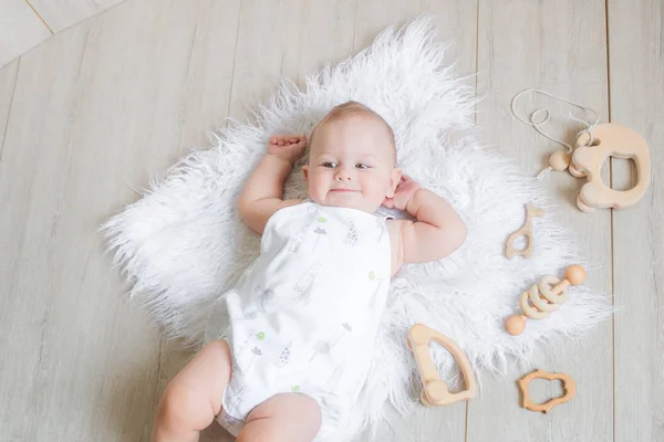 Lovely Cute Newborn Baby Lies White Rug Plays First Eco — Stock Photo, Image