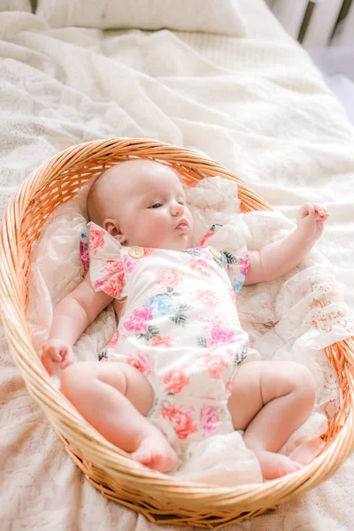 Cute Babe Baby Floral Print Clothes Lies Wicker Basket White — Stock Photo, Image