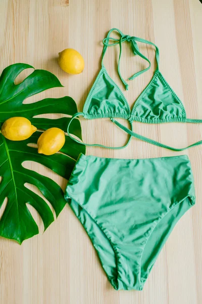 Bright Trendy Bikini Wooden Background Yellow Lemons Tropical Green Leaves — Stock Photo, Image