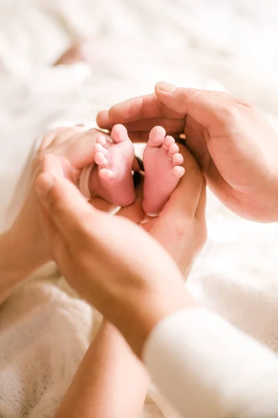 Mom Father Hands Holding Little Cute Legs Newborn Baby Home — Stock Photo, Image